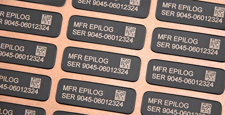 A jig of engraved identification tags
